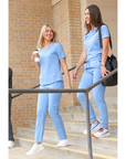 Woman Walking in Ceil Blue Women's Stash-Pocket Scrub Top