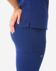 Women's 9-Pocket Scrub Pants Navy Straight Tapered Leg Closeup Side View Signature Mesh Panels