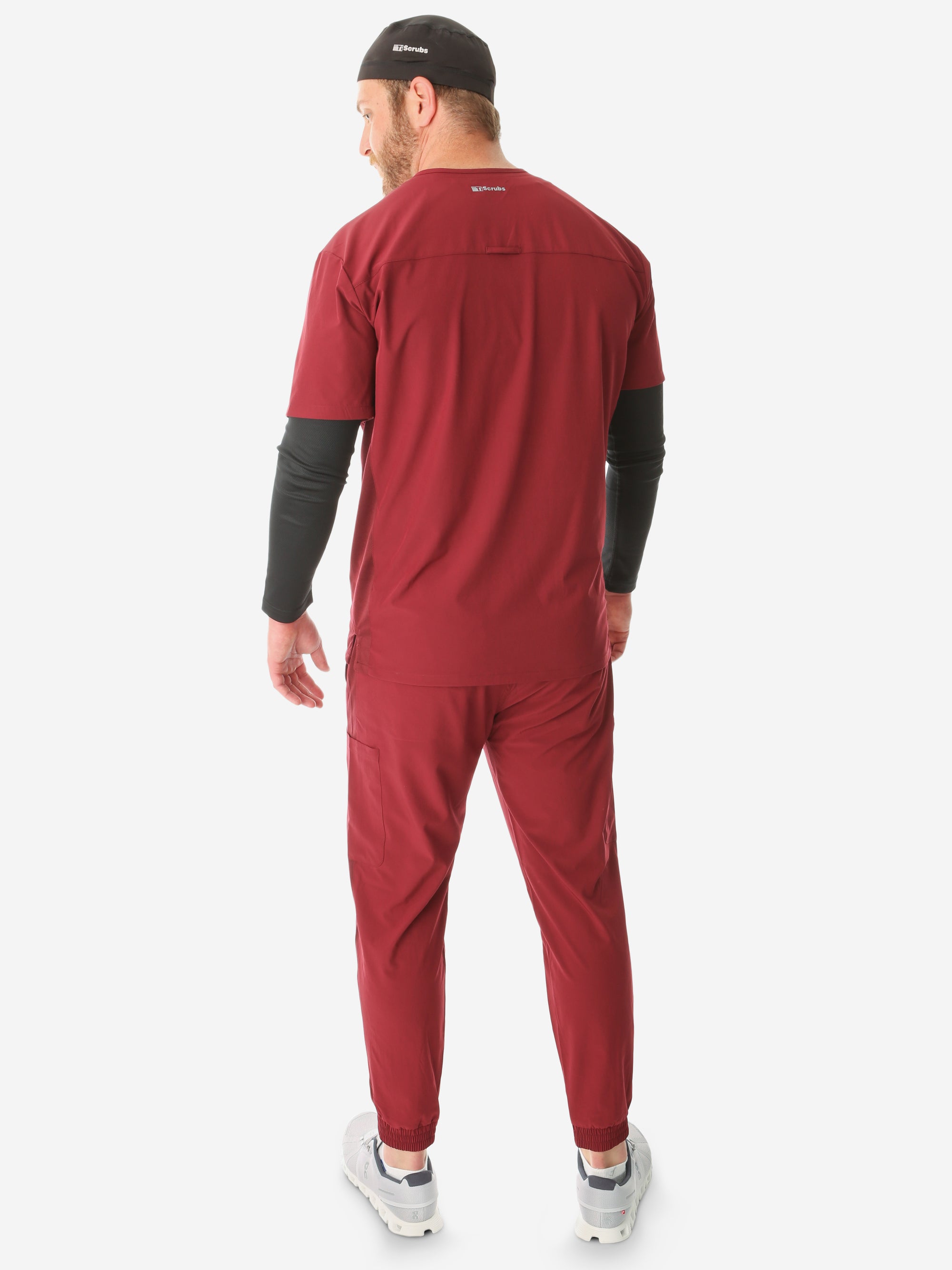 TiScrubs Stretch Men's Bold Burgundy Stretch Jogger Scrub Pants and Double-Pocket Top Untucked Long Sleeve Black Underscrub and Scrub Cap Full Body Back