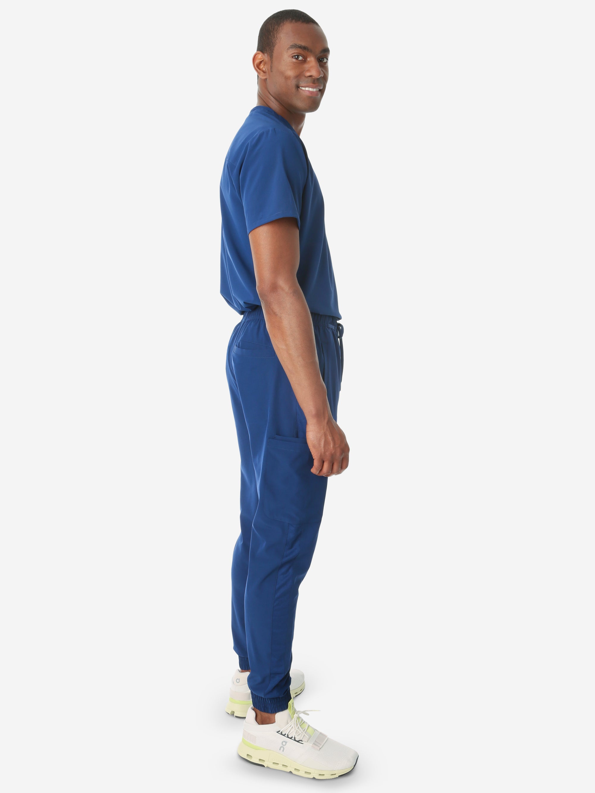 TiScrubs Stretch Men's Navy Blue Jogger Scrub Pants and Double-Pocket Top Full Body Side