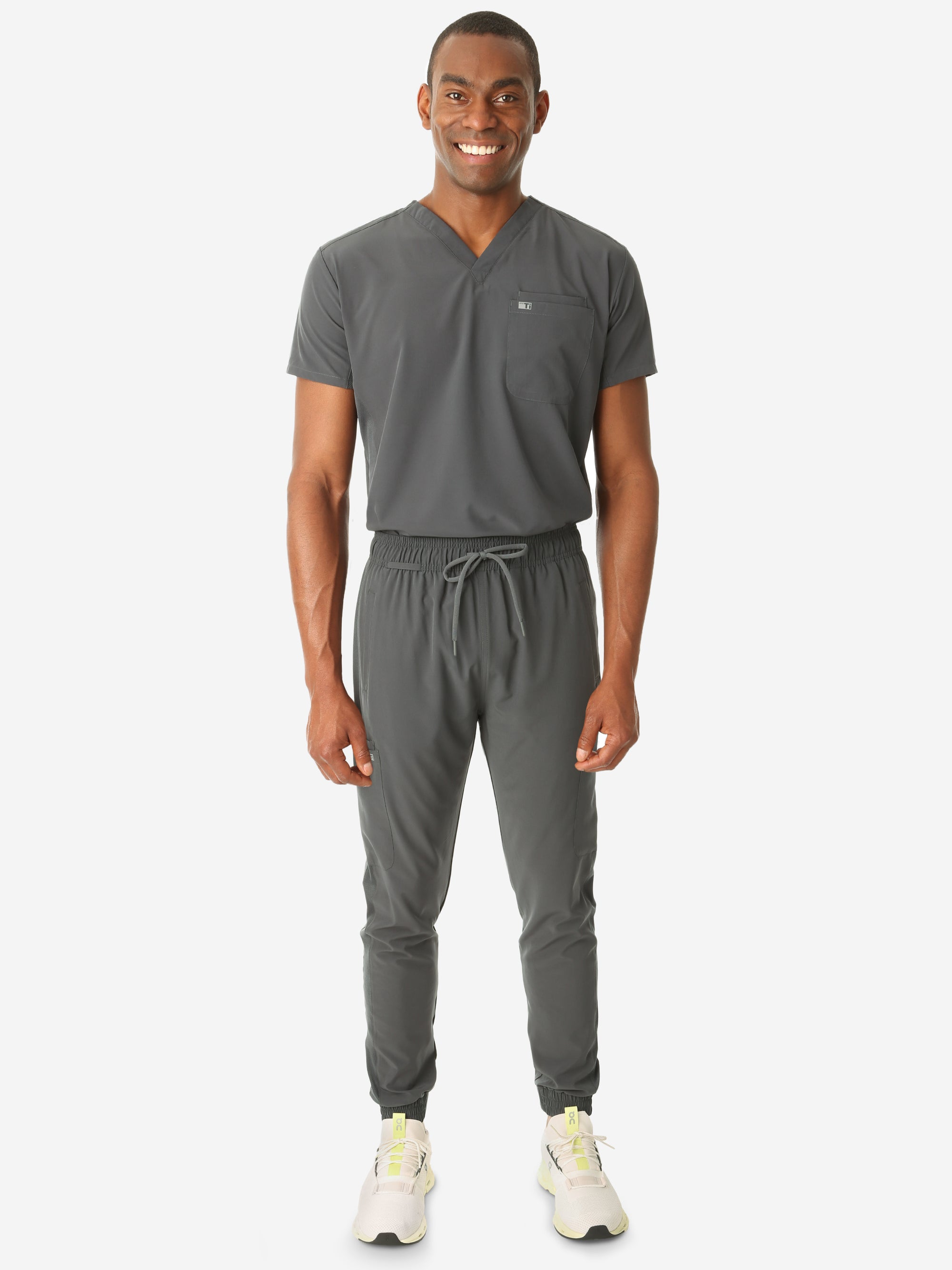 TiScrubs Stretch Men's Charcoal Gray Scrub Jogger Pants and Double-Pocket Top Tucked Full Body Front