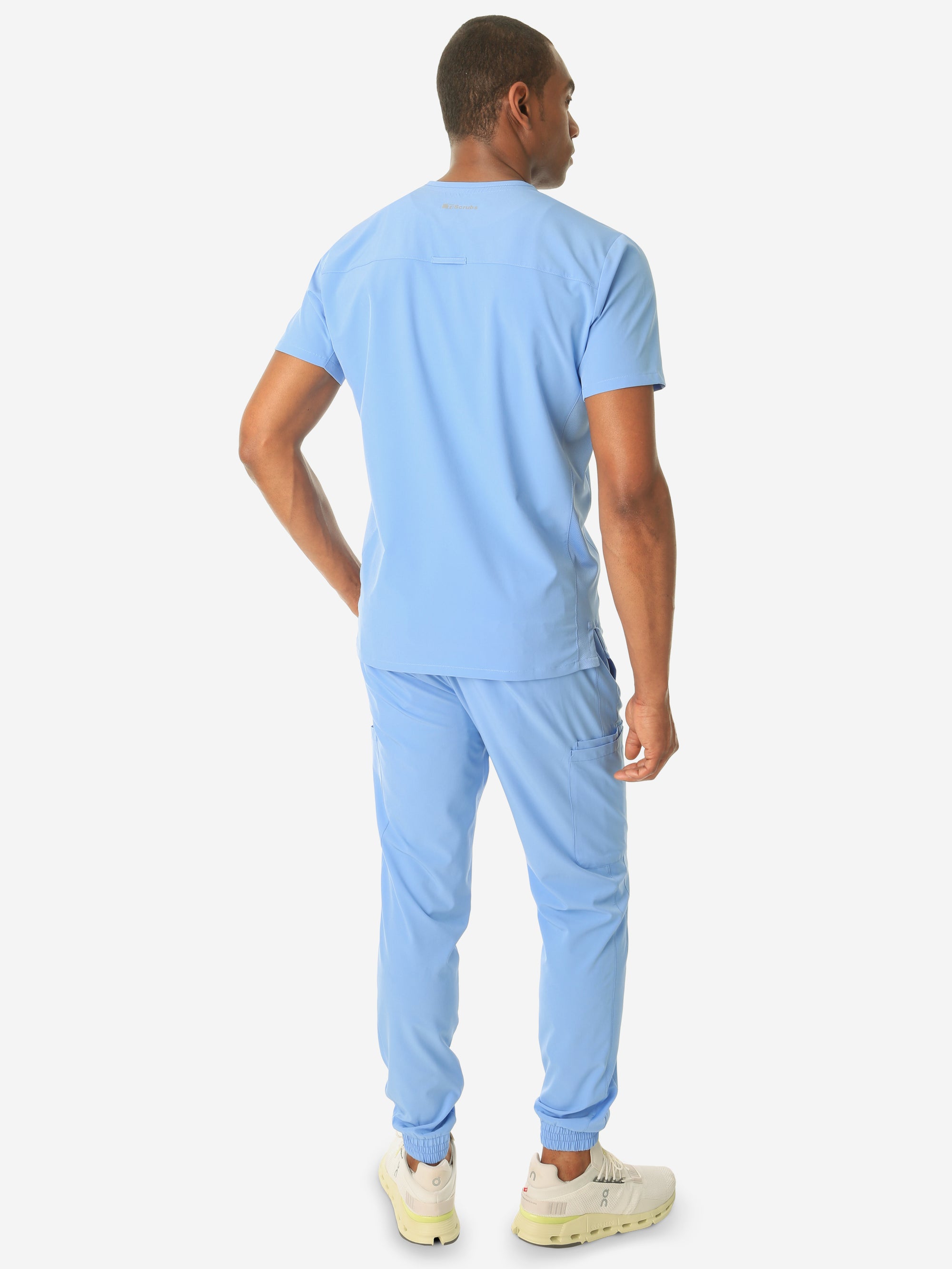 TiScrubs Men's Ceil Blue Double-Pocket Scrub Top Untucked and Joggers Full Body Back