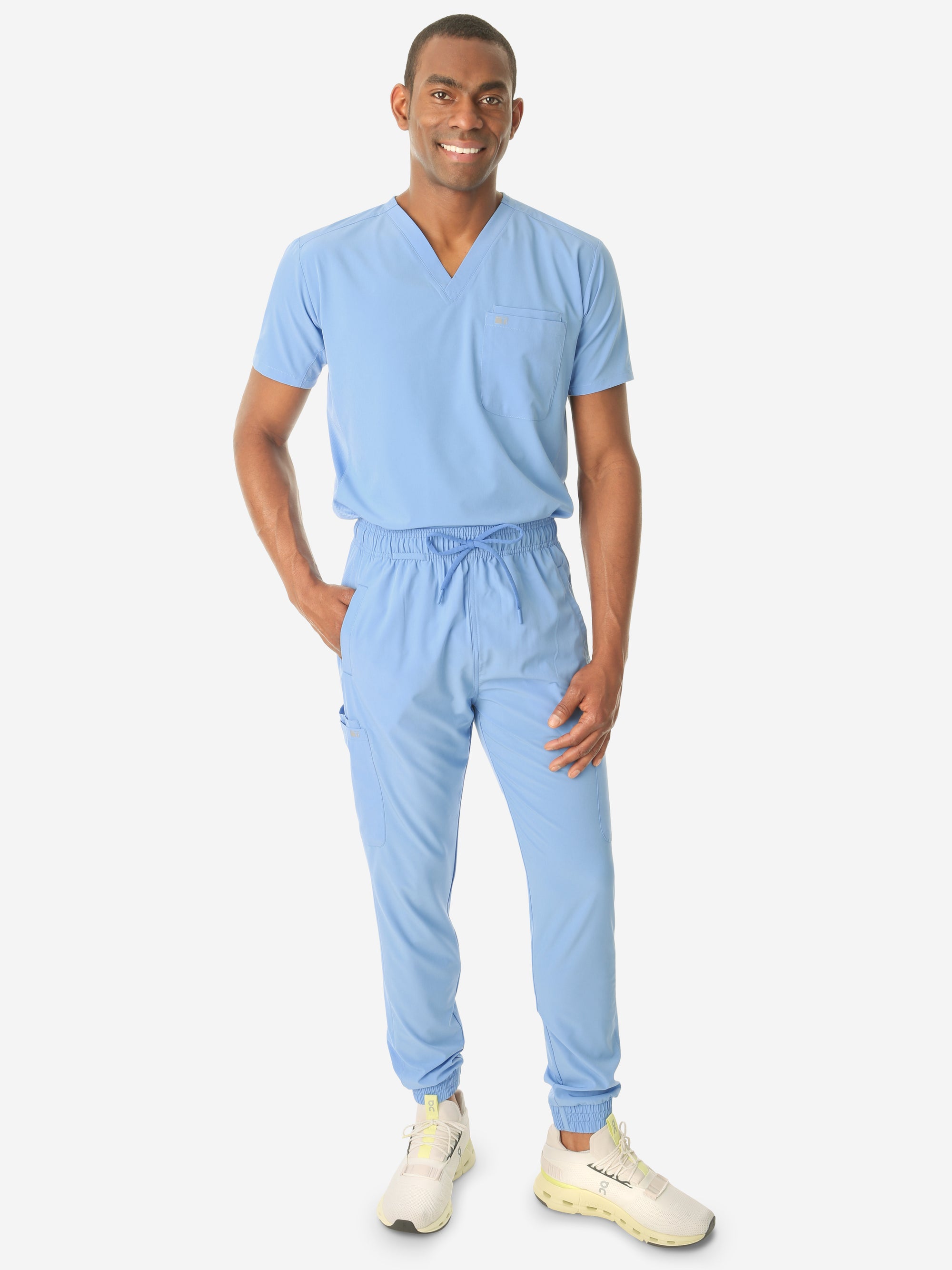 TiScrubs Men's Ceil Blue Double-Pocket Scrub Top Tucked and Joggers Full Body Front