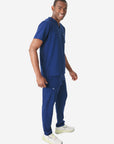 Men's Double-Pocket Scrub Top Navy Blue Untucked Side View with 9-Pocket Pants