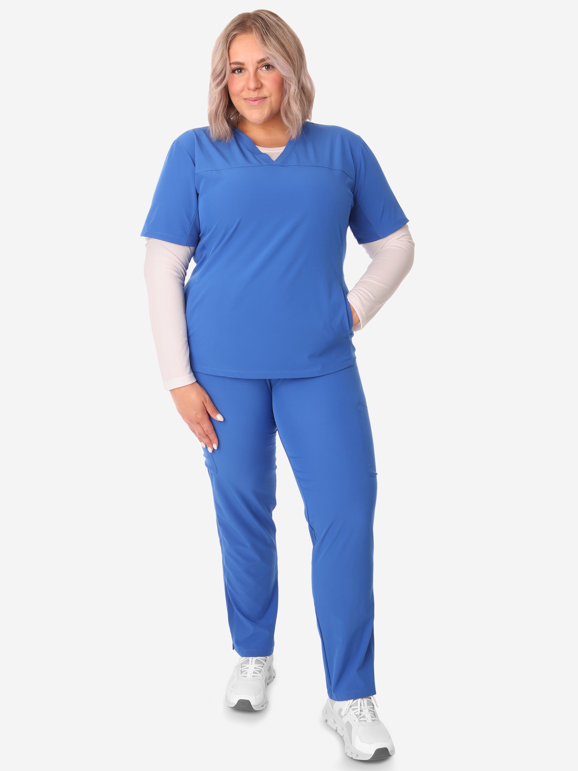 TiScrubs Women's White Long-Sleeve Mesh Underscrub Under Royal Blue Stash-Pocket Top 9-Pocket Pants Full Body Front