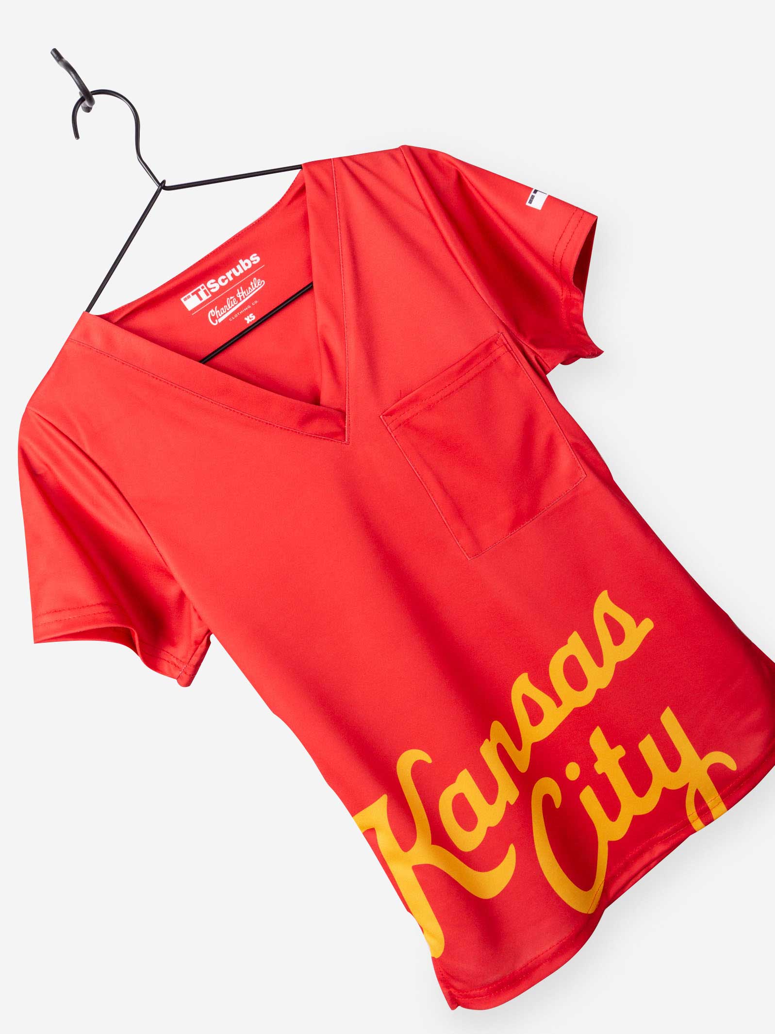Women's Charlie Hustle Scrub Top with Kansas City Script in Red and Gold and chest pocket