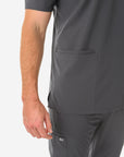Men's Charocal Gray Five-Pocket Scrub Top Full Body Lower Pockets Closeup