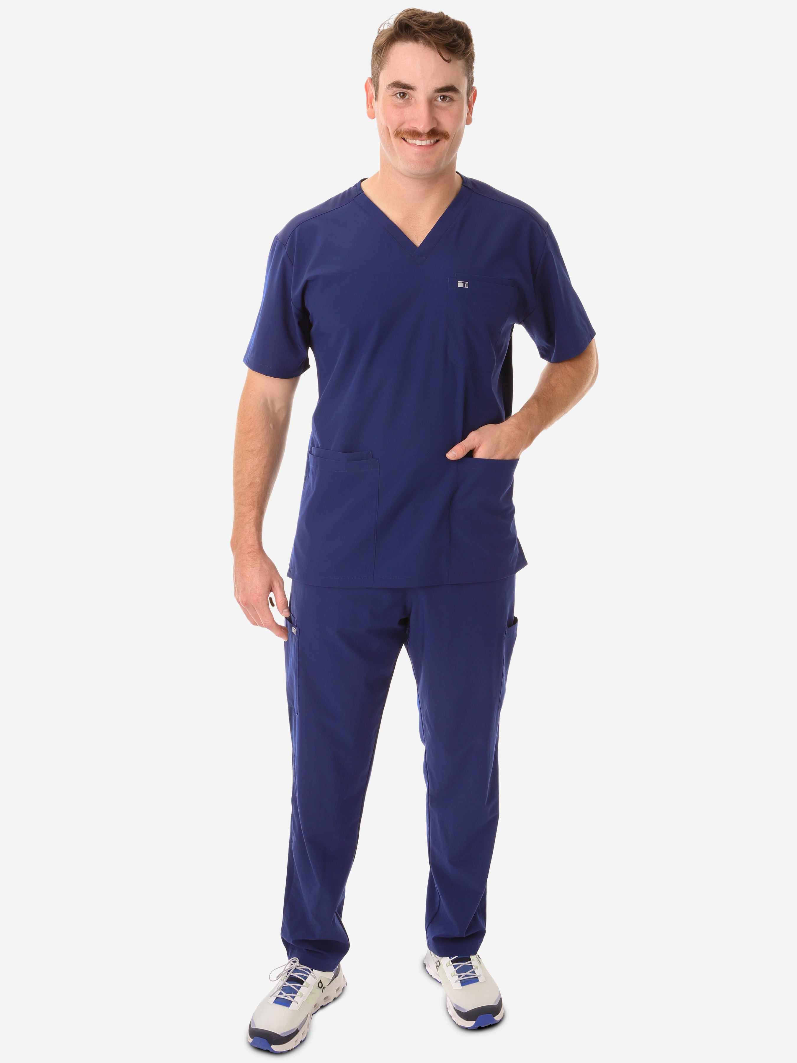 Men&#39;s Navy Blue Five-Pocket Scrub Top Full Body Front View with 9-Pocket Pants