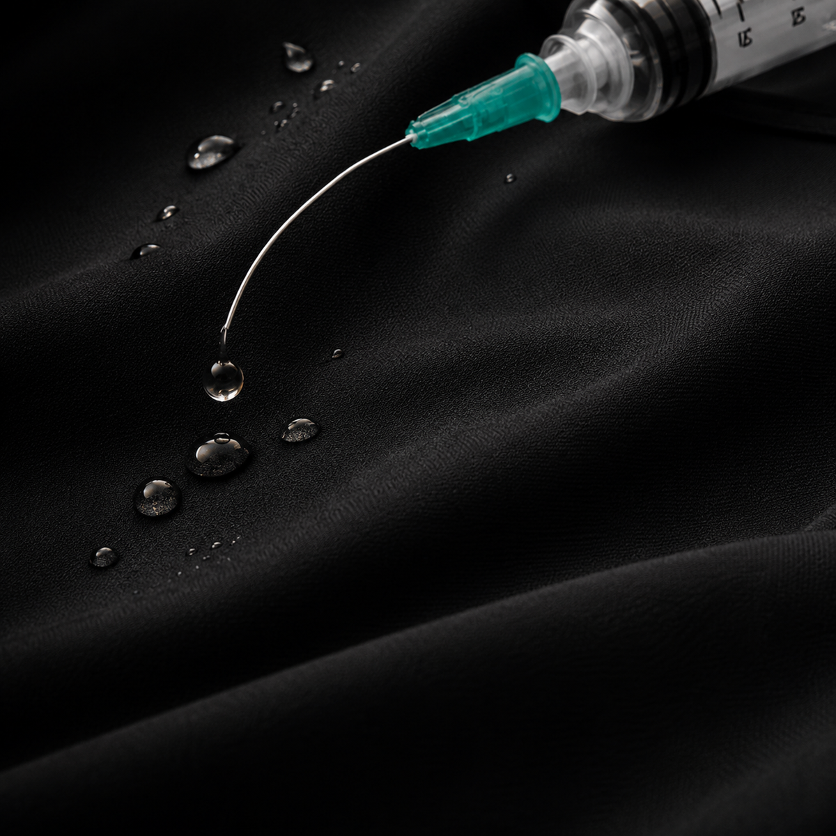 Bleach-resistant performance fabric on a men's black TiScrubs scrub top