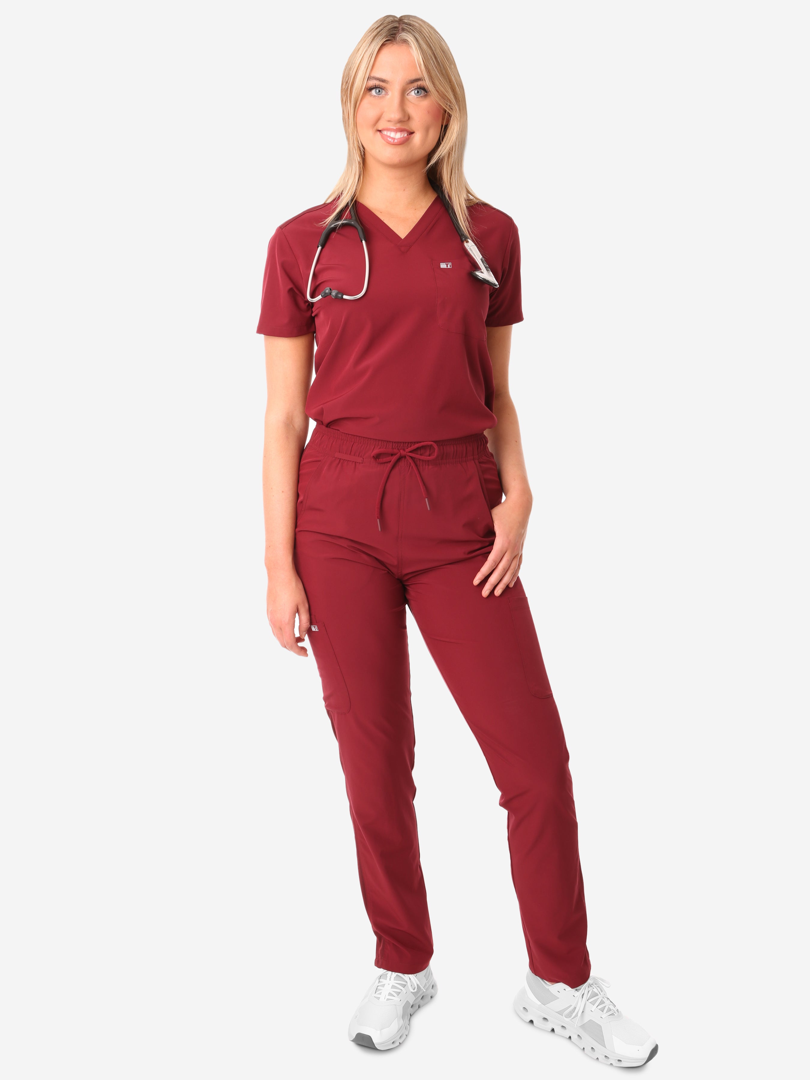 TiScrubs Bold Burgundy Women&#39;s Stretch 9-Pocket Pants and One-Pocket Tuckable Top Front View Full Body