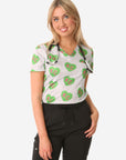 Women's Charlie Hustle All-Over KC Heart Scrub Top One Pocket Green and Pink Front View Top Only Tucked