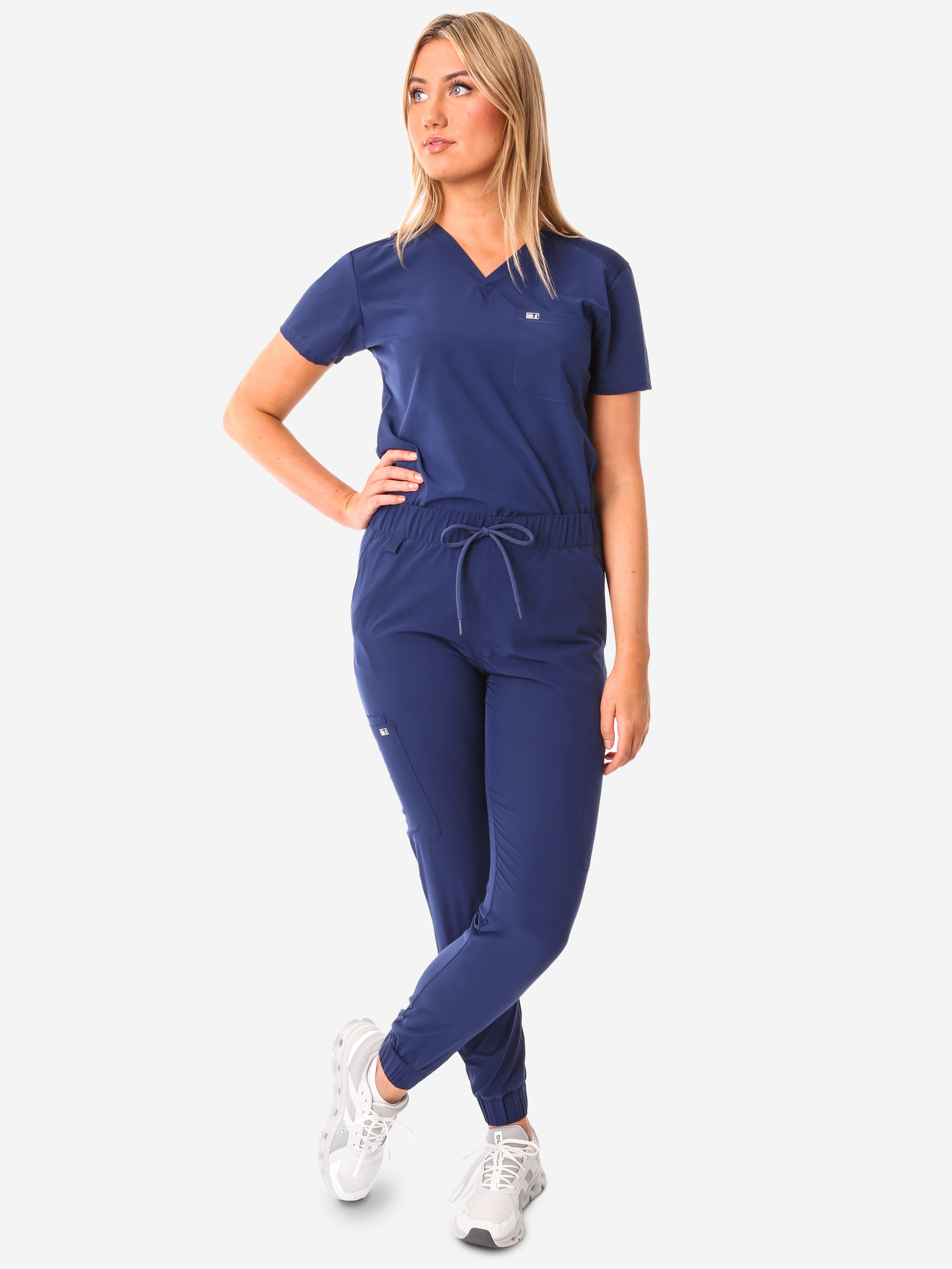 TiScrubs Navy Blue Women&#39;s Stretch Perfect Jogger Pants and One-Pocket Tuckable Top Front View Full Body