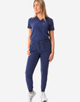 TiScrubs Women's Stretch Navy Blue One-Pocket Scrub Top Tucked and Joggers Front View Full Body