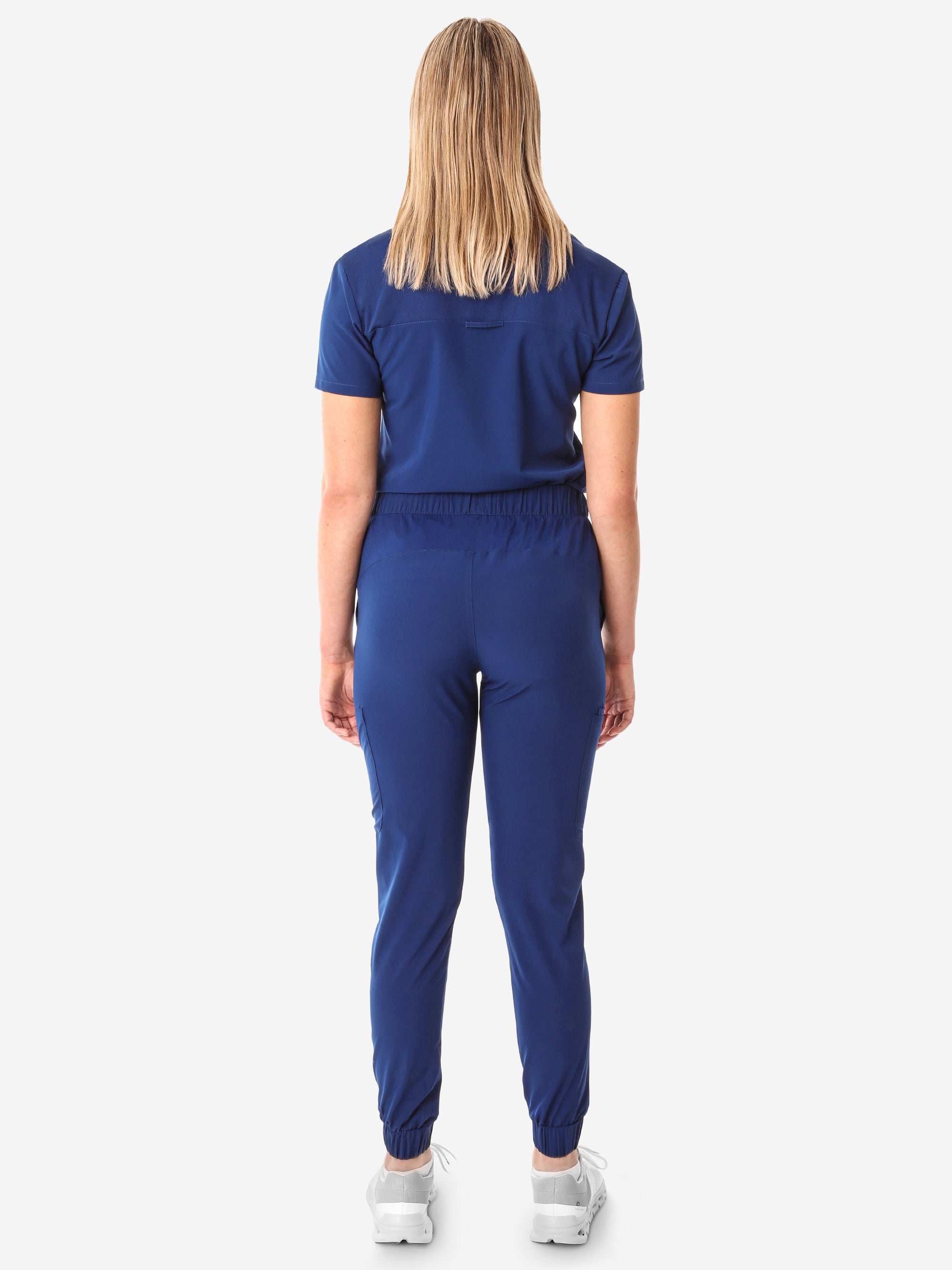 Women&#39;s Navy Blue Perfect Scrub Joggers Full Body Back with One-Pocket Scrub Top Tucked