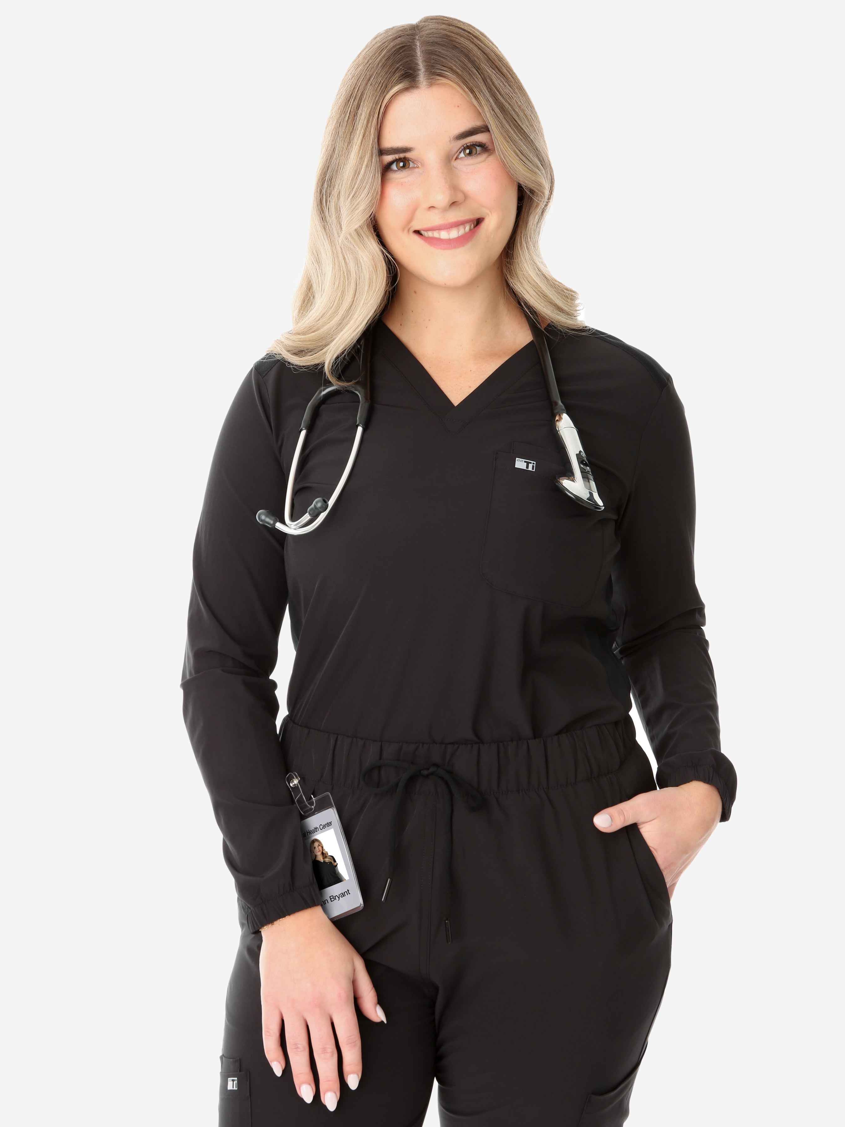 Women&#39;s Real Black Long-Sleeve Scrub Top Front View Top Only Tucked with Stethoscope