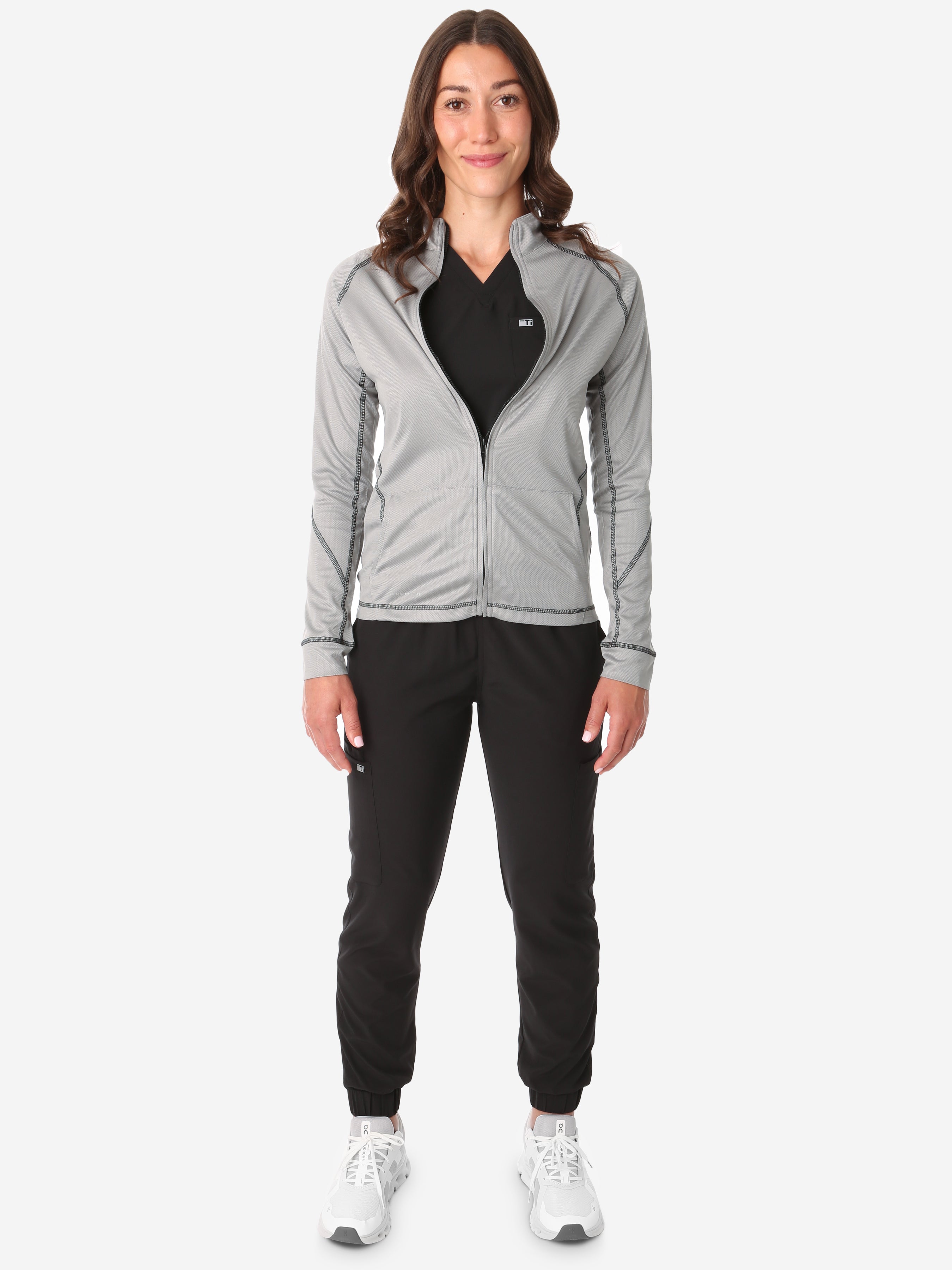 Women&#39;s Mesh Scrub Jacket Zipped Titanium Gray Front View Full Body Plus Black Stretch Scrubs