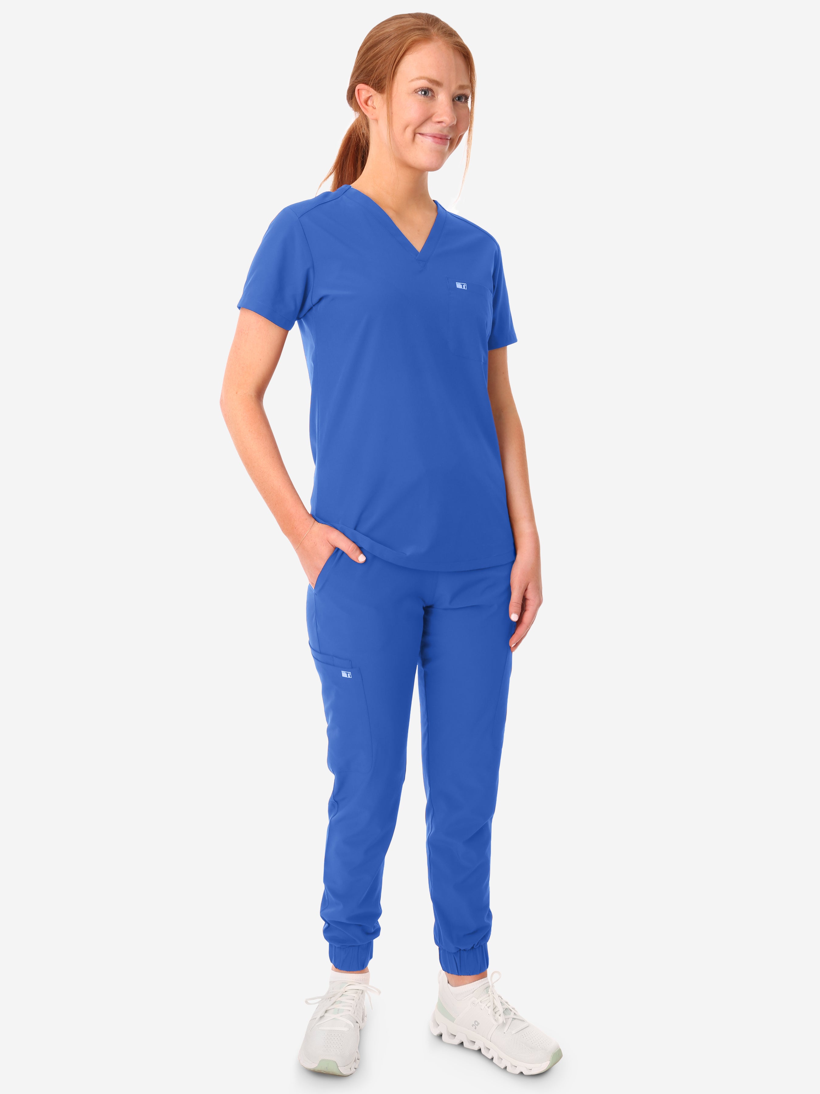 TiScrubs Women&#39;s Stretch Royal Blue One-Pocket Scrub Top Untucked with Joggers Front View Full Body