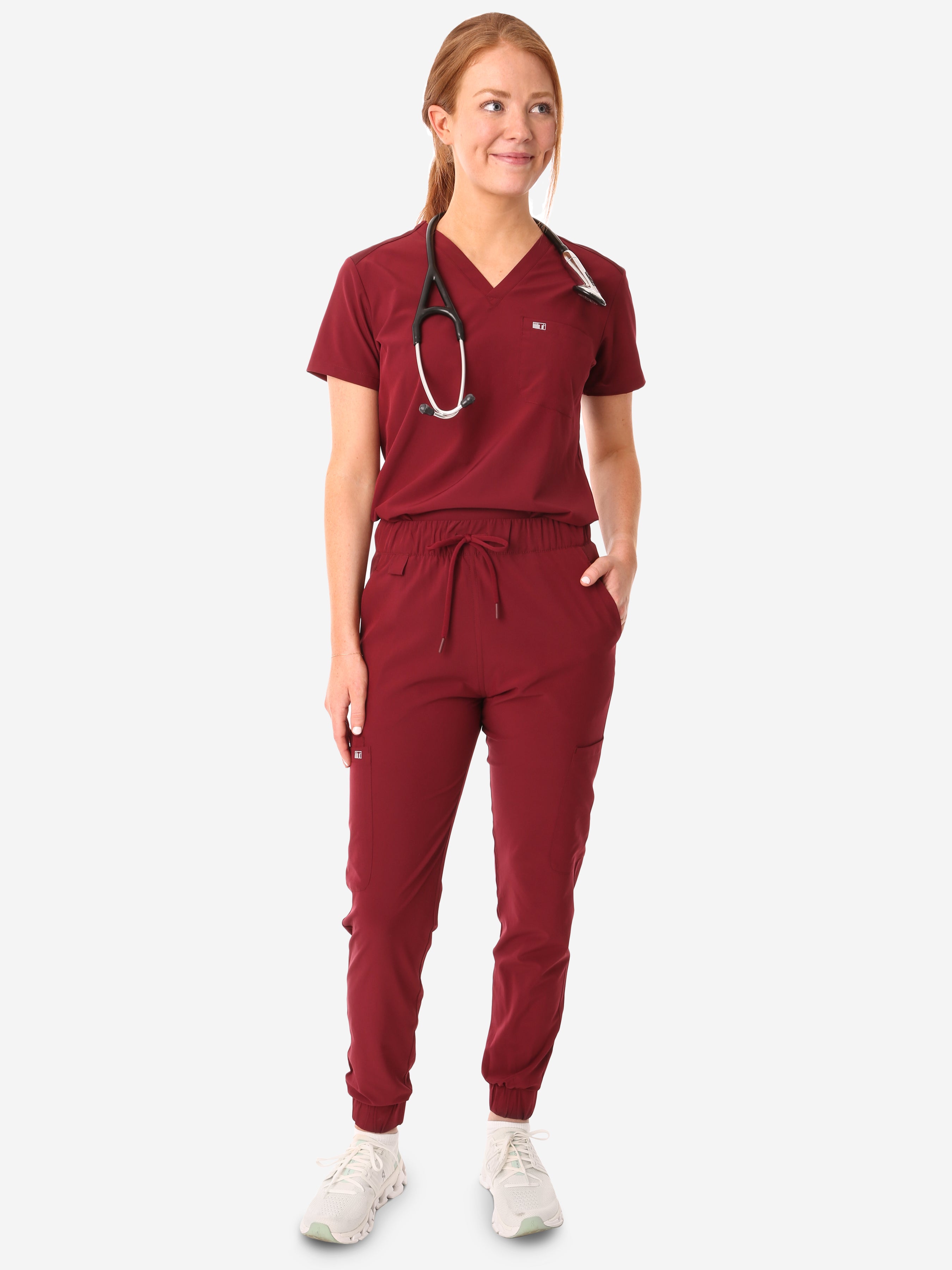 TiScrubs Bold Burgundy Women&#39;s Stretch Perfect Jogger Pants and One-Pocket Tuckable Top Front View Full Body