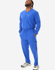 Men's Long Sleeve Scrub Top with Two Chest Pockets Royal Blue Full Body Front View with 9-Pocket Pants