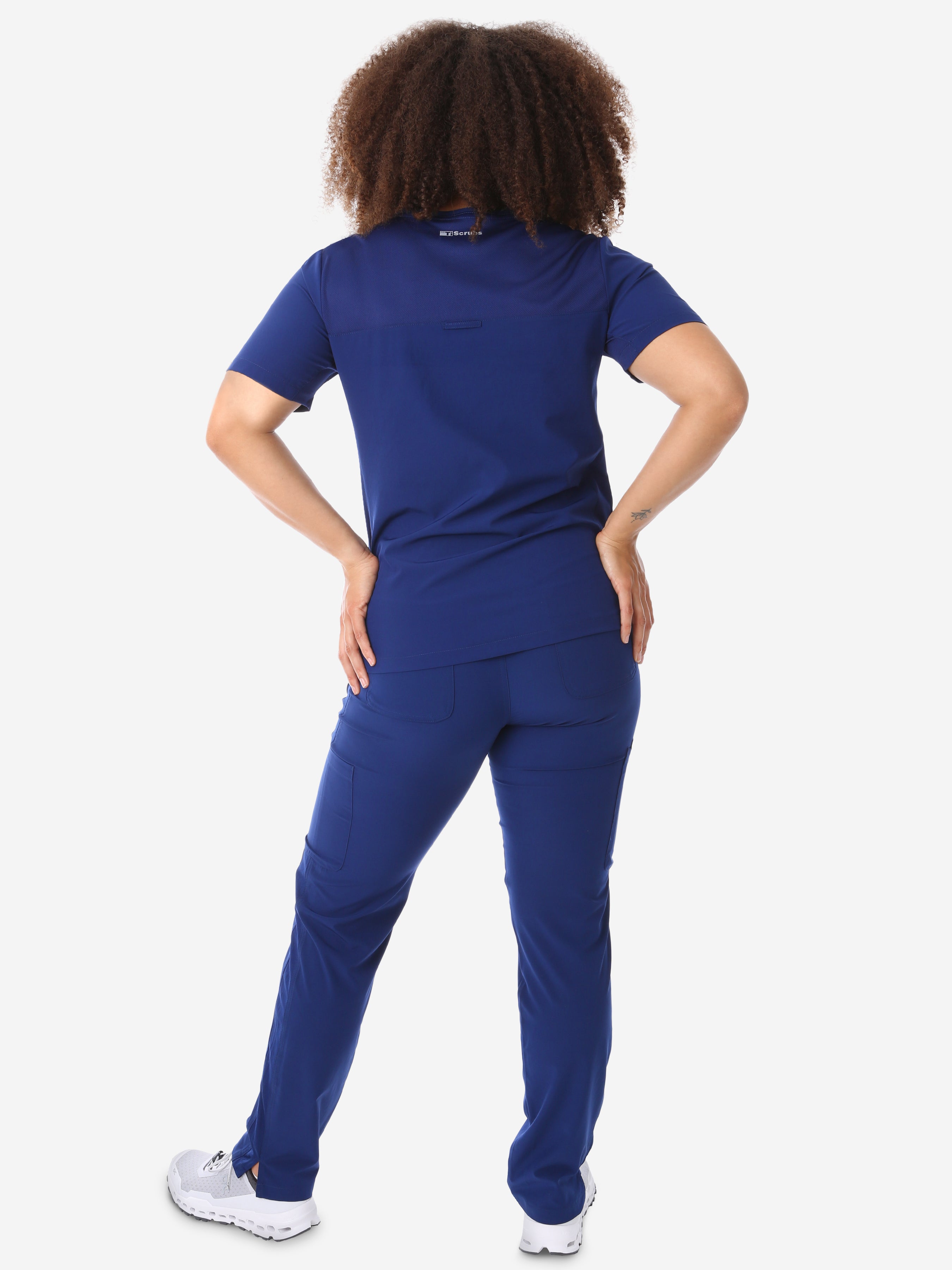 Women&#39;s Four-Pocket Scrub Top Navy Blue Full Body Back  View with 9-Pocket Pants