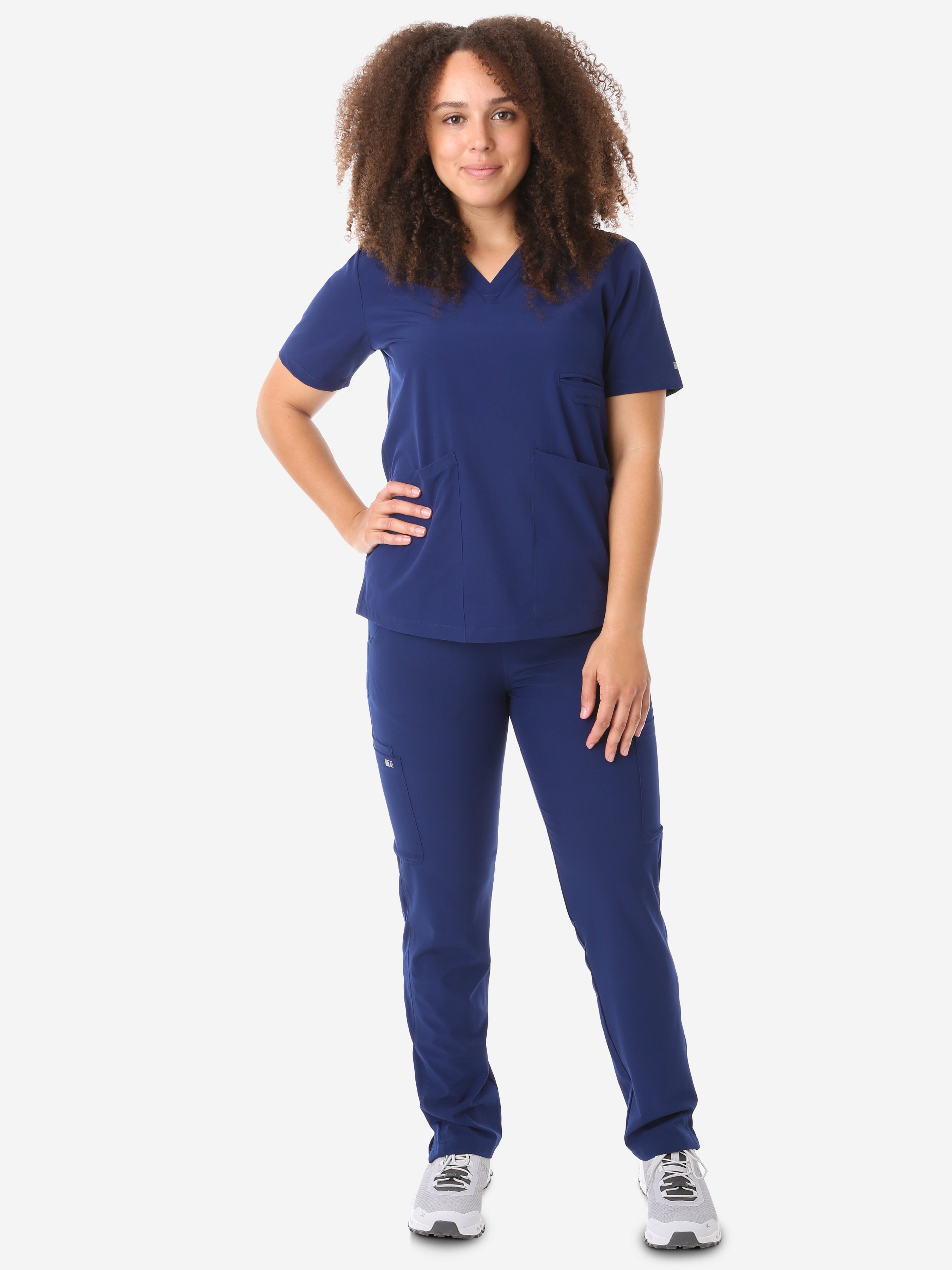 Women&#39;s Four-Pocket Scrub Top Navy Blue Full Body Front View with 9-Pocket Pants