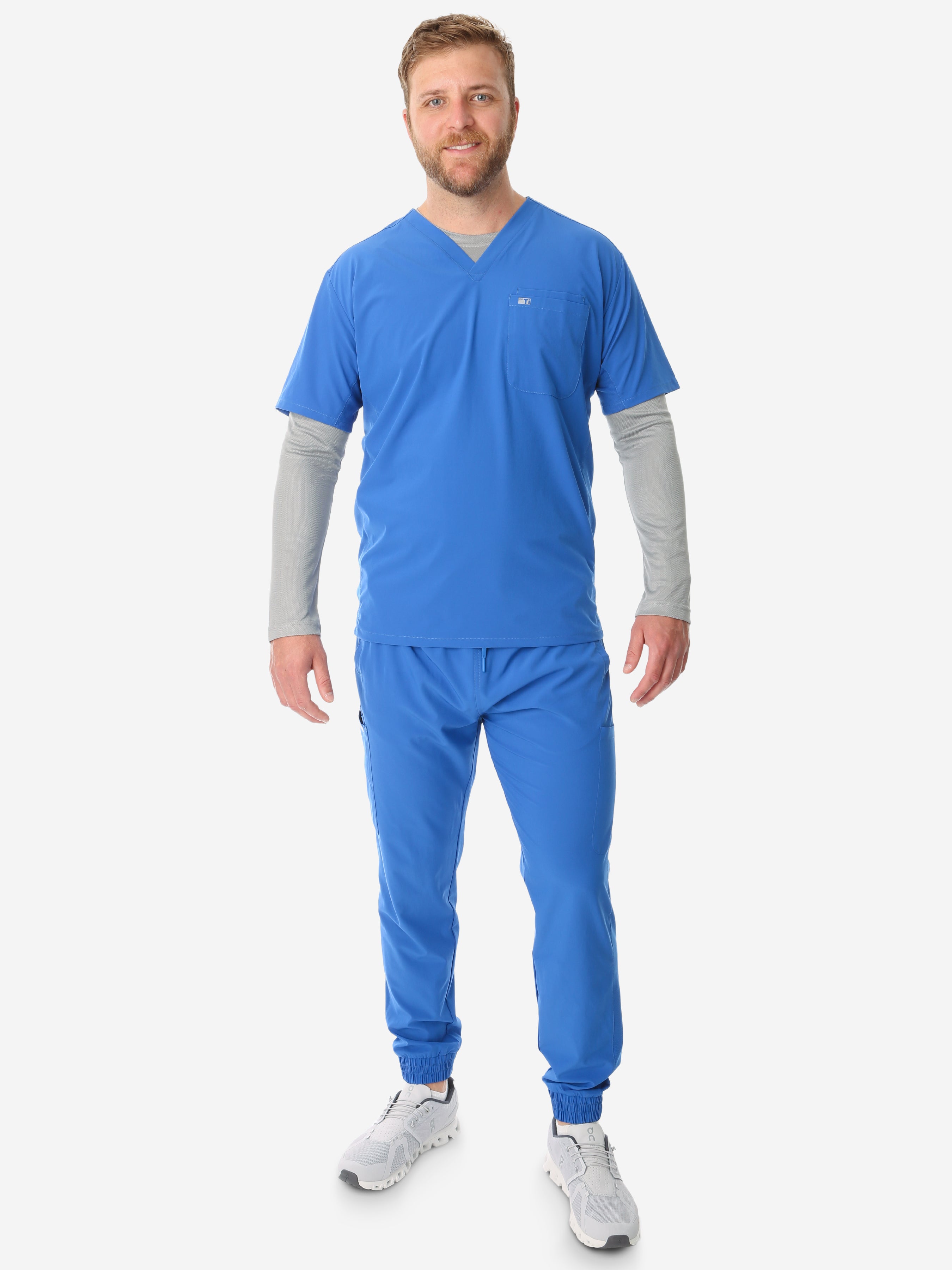 TiScrubs Titanium Gray Men&#39;s Mesh Long-Sleeve Underscrub Top Full Body Back with Royal Blue Scrub Joggers and Double-Pocket Top