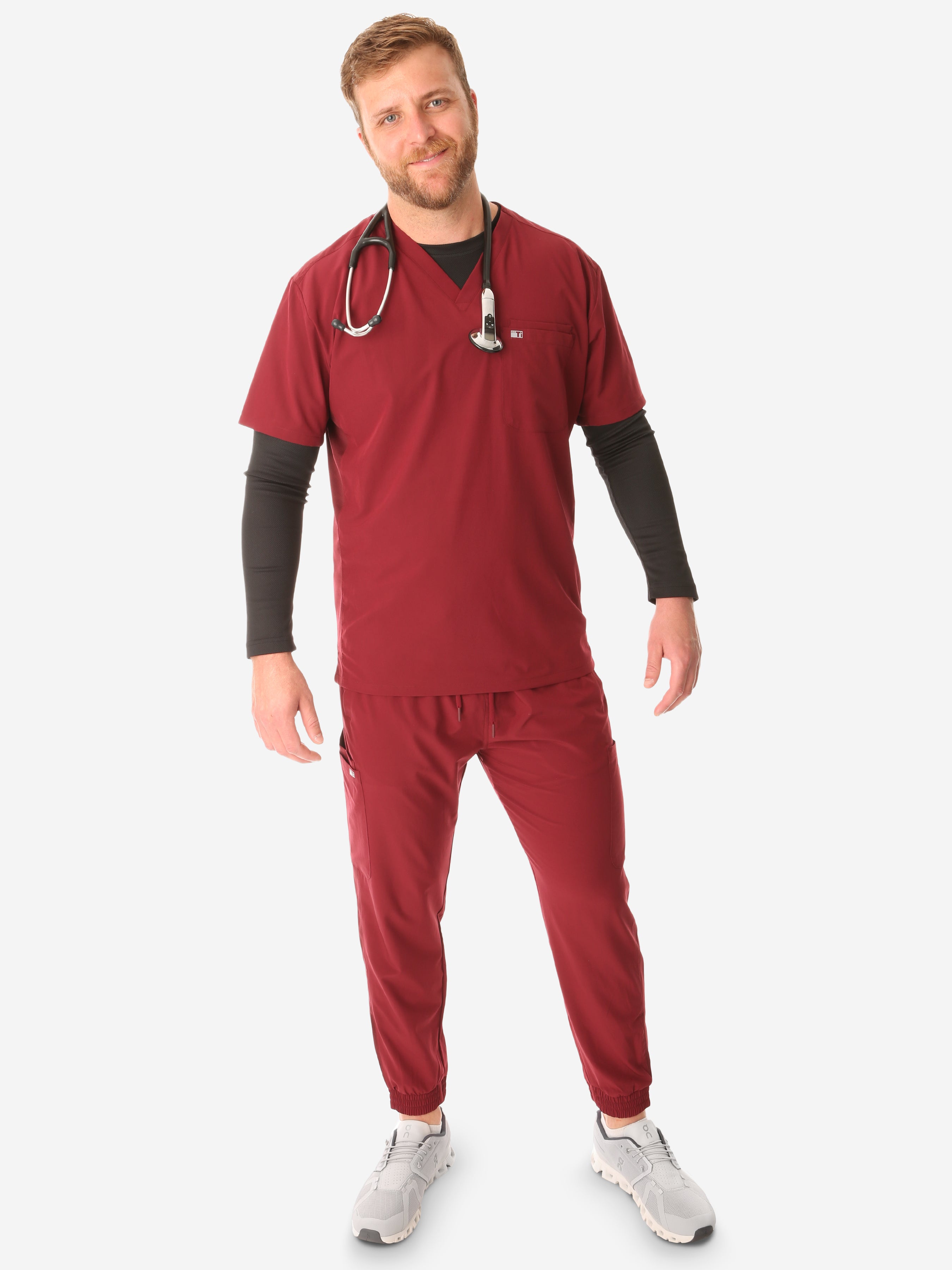 TiScrubs Men&#39;s Stretch Bold Burgundy Double-Pocket Scrub Top and Joggers with Long-Sleeve Black Underscrub Full Body Front