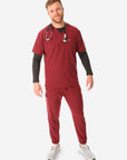 TiScrubs Men's Stretch Bold Burgundy Double-Pocket Scrub Top and Joggers with Long-Sleeve Black Underscrub Full Body Front