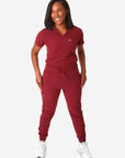 TiScrubs Women's Stretch Bold Burgundy One-Pocket Tuckable Scrub Top and 9-Pocket Pants Untucked  Full Body Front