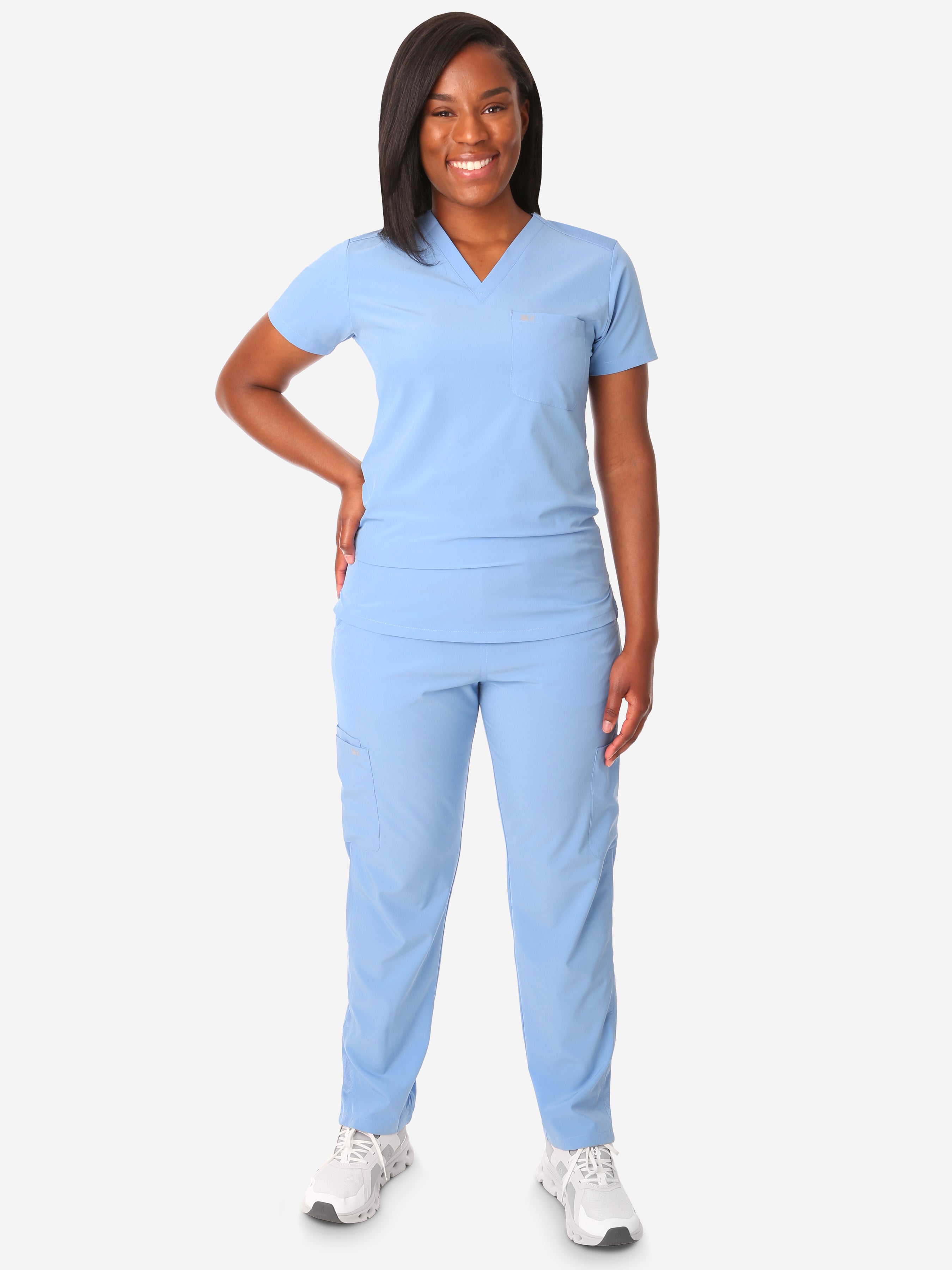 TiScrubs Women&#39;s Stretch Ceil Blue One-Pocket Tuckable Scrub Top and 9-Pocket Pants Untucked  Full Body Front