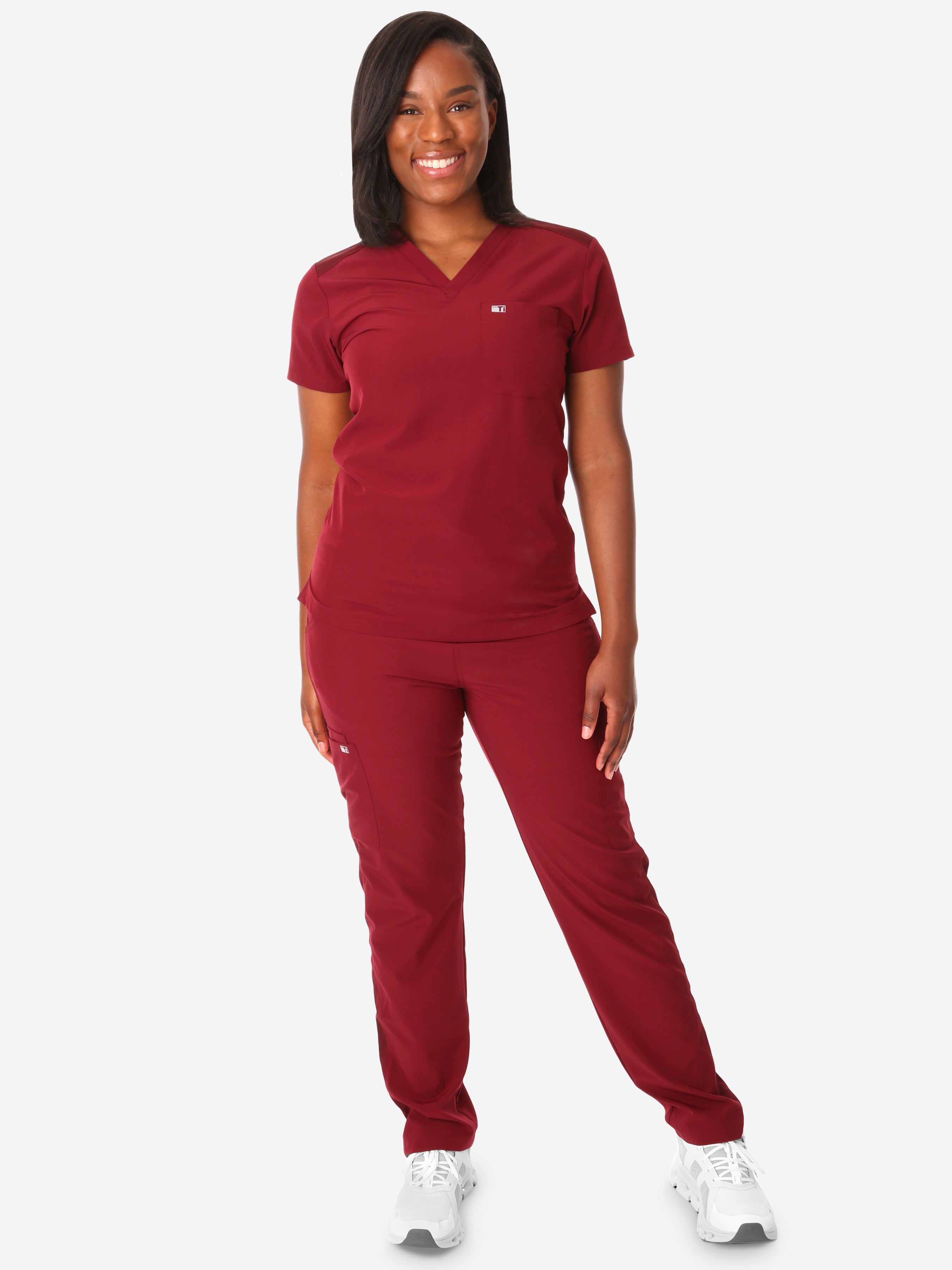 TiScrubs Women&#39;s Stretch Bold Burgundy One-Pocket Tuckable Scrub Top and 9-Pocket Pants Untucked  Full Body Front