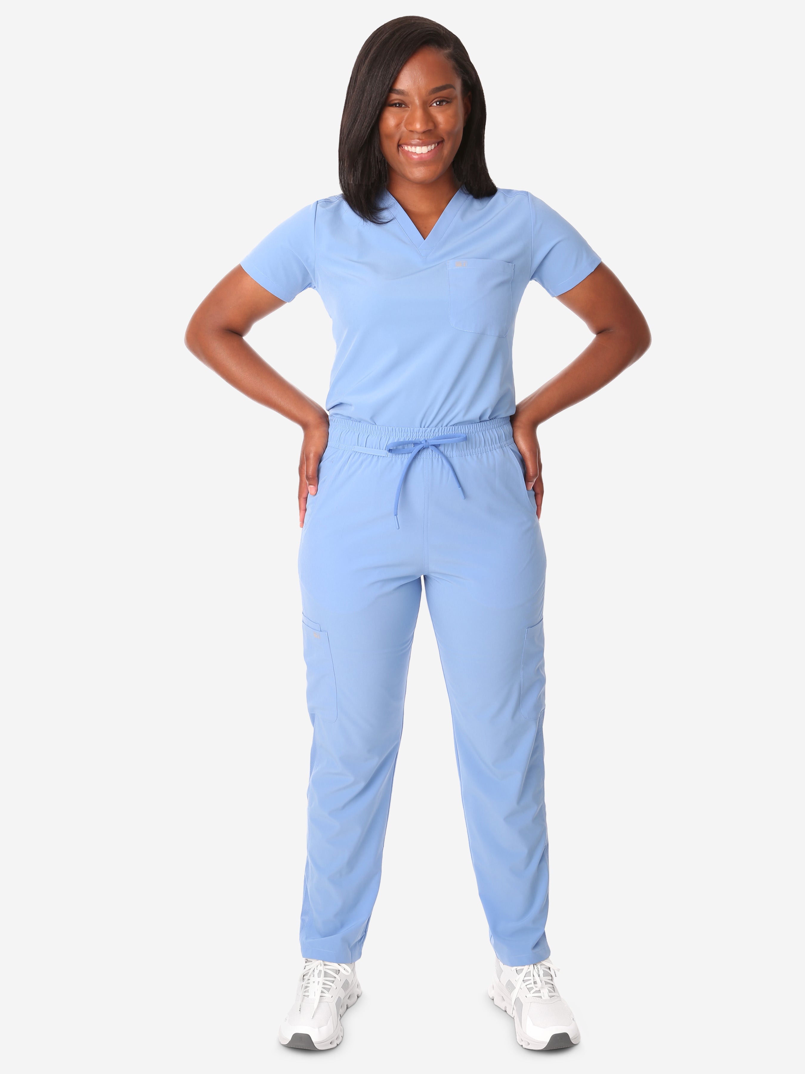 TiScrubs Ceil Blue Women&#39;s Stretch 9-Pocket Pants and One-Pocket Tuckable Top Front View Full Body
