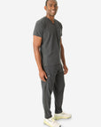 Men's Double Pocket Scrub Top Untucked Charcoal Gray Full Body Side View with 9-Pocket Pants