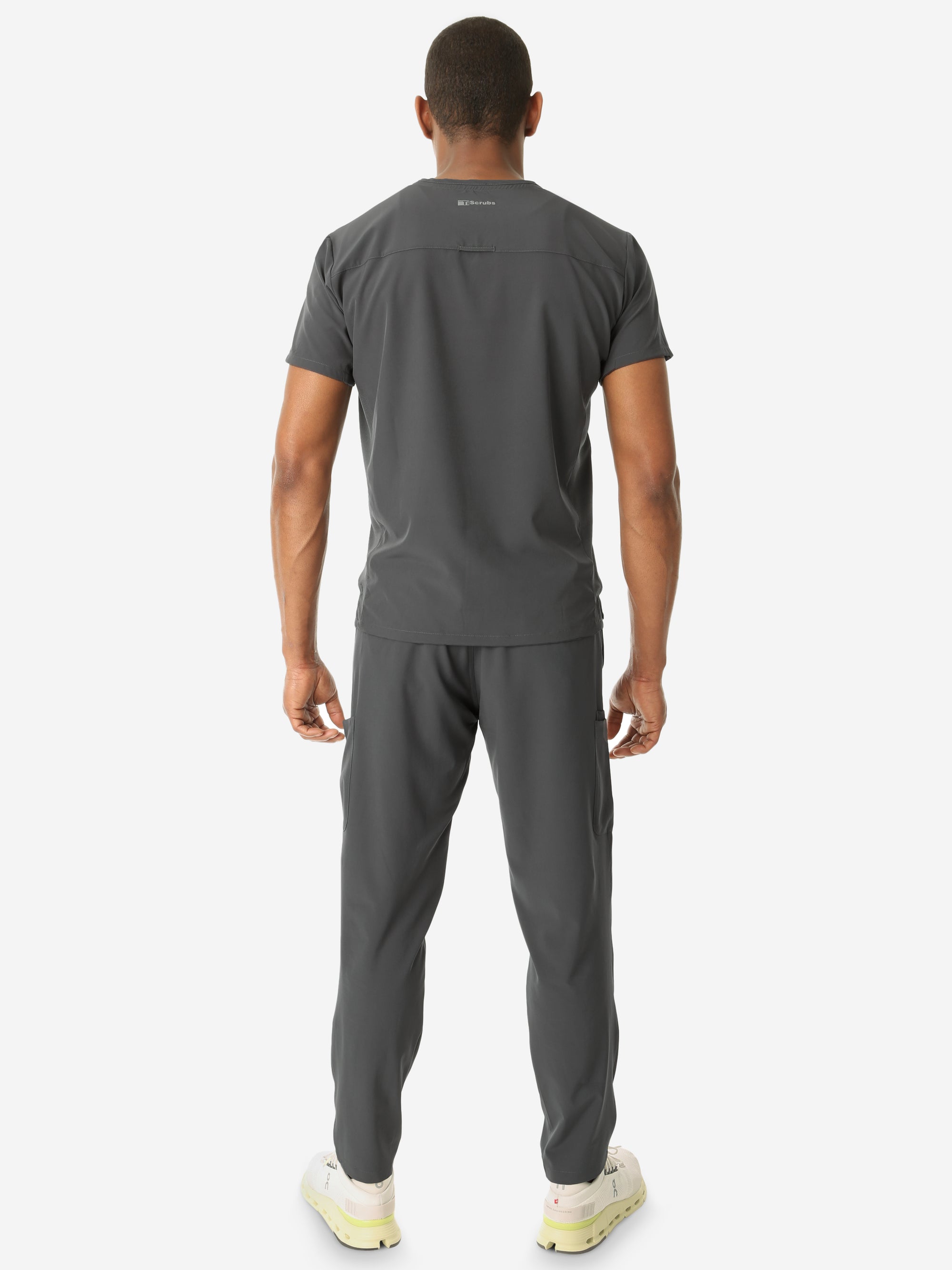 Men&#39;s Double Pocket Scrub Top Untucked Charcoal Gray Full Body Back View with 9-Pocket Pants