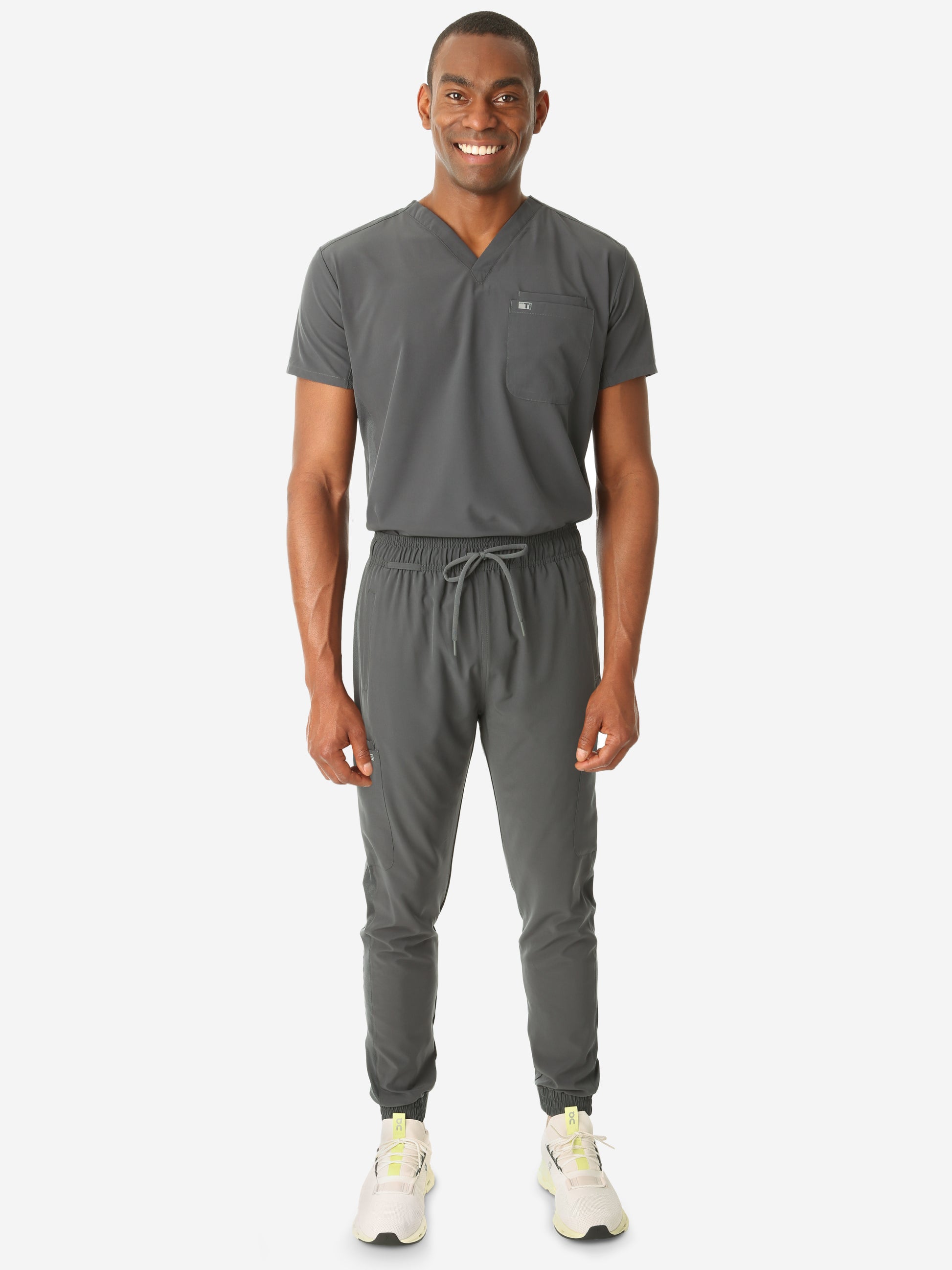 TiScrubs Stretch Men's Charcoal Gray Scrub Jogger Pants and Double-Pocket Top Tucked Full Body Front