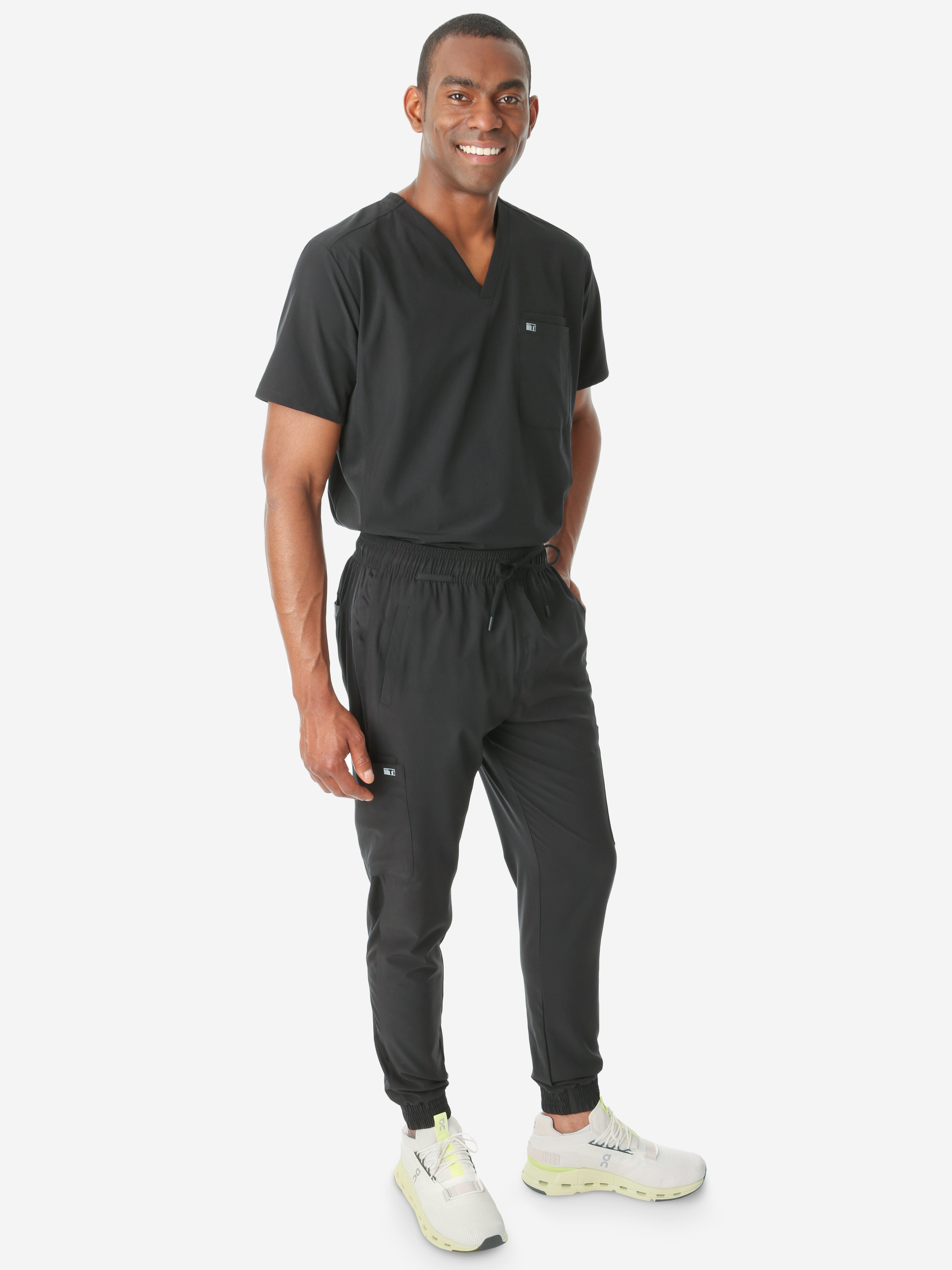 TiScrubs Stretch Real Black Jogger Scrub Pants and Double Pocket Top Tucked Full Body Front
