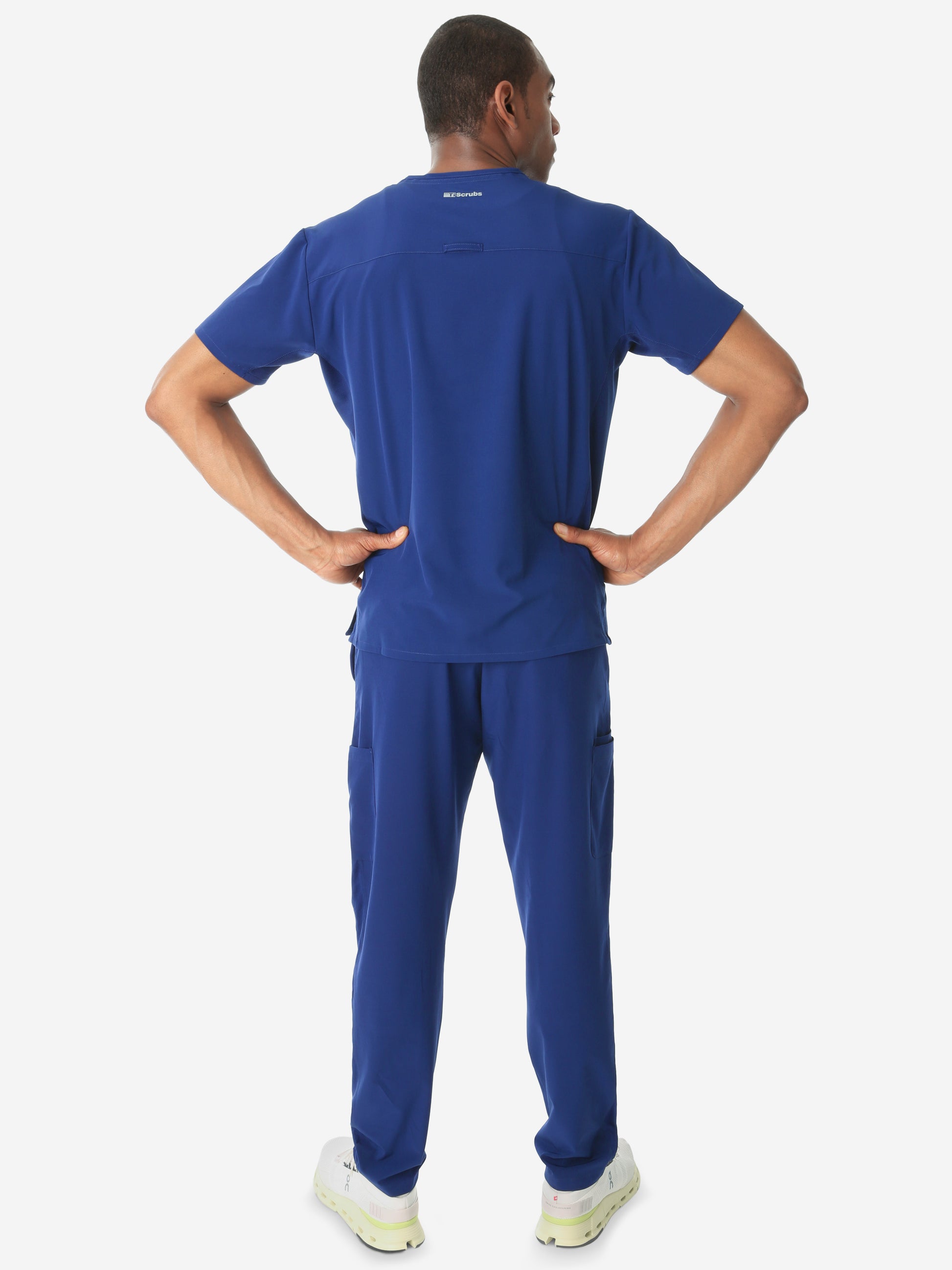 Men's Double-Pocket Scrub Top Navy Blue Untucked Back View with 9-Pocket Pants