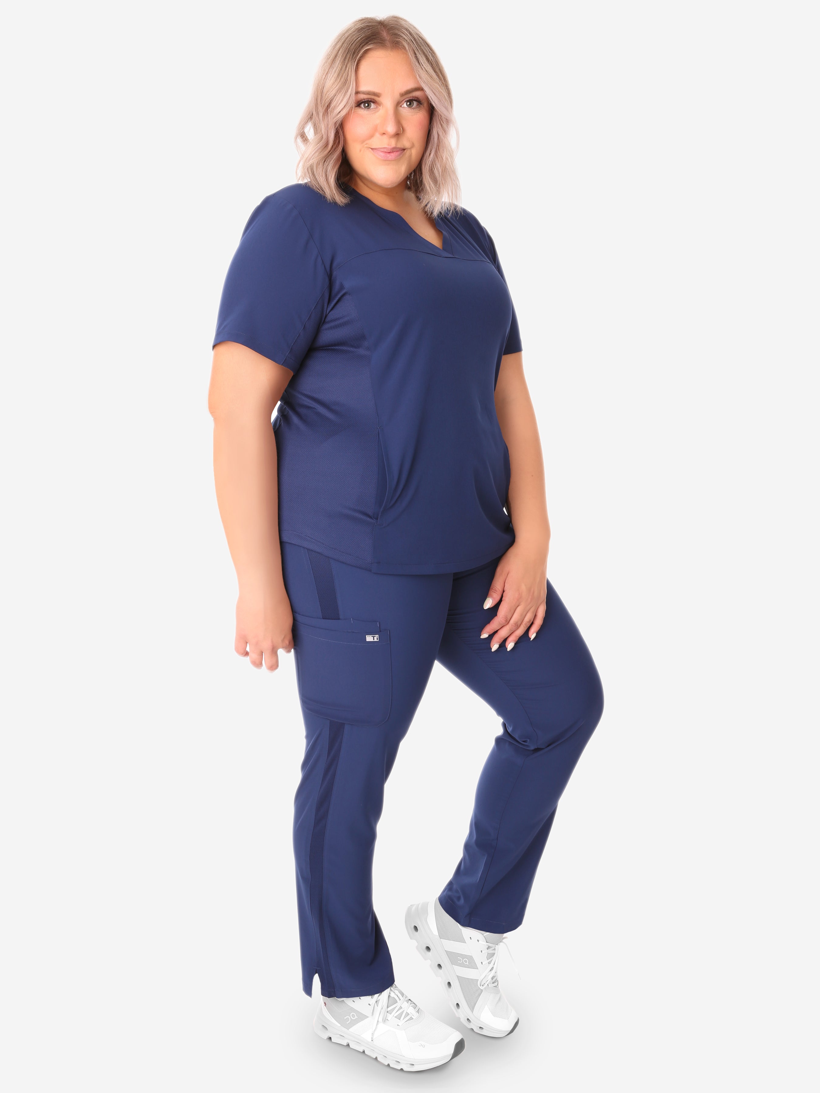 TiScrubs Navy Blue Women&#39;s Stretch 9-Pocket Pants and Stash-Pocket Top Side View Full Body