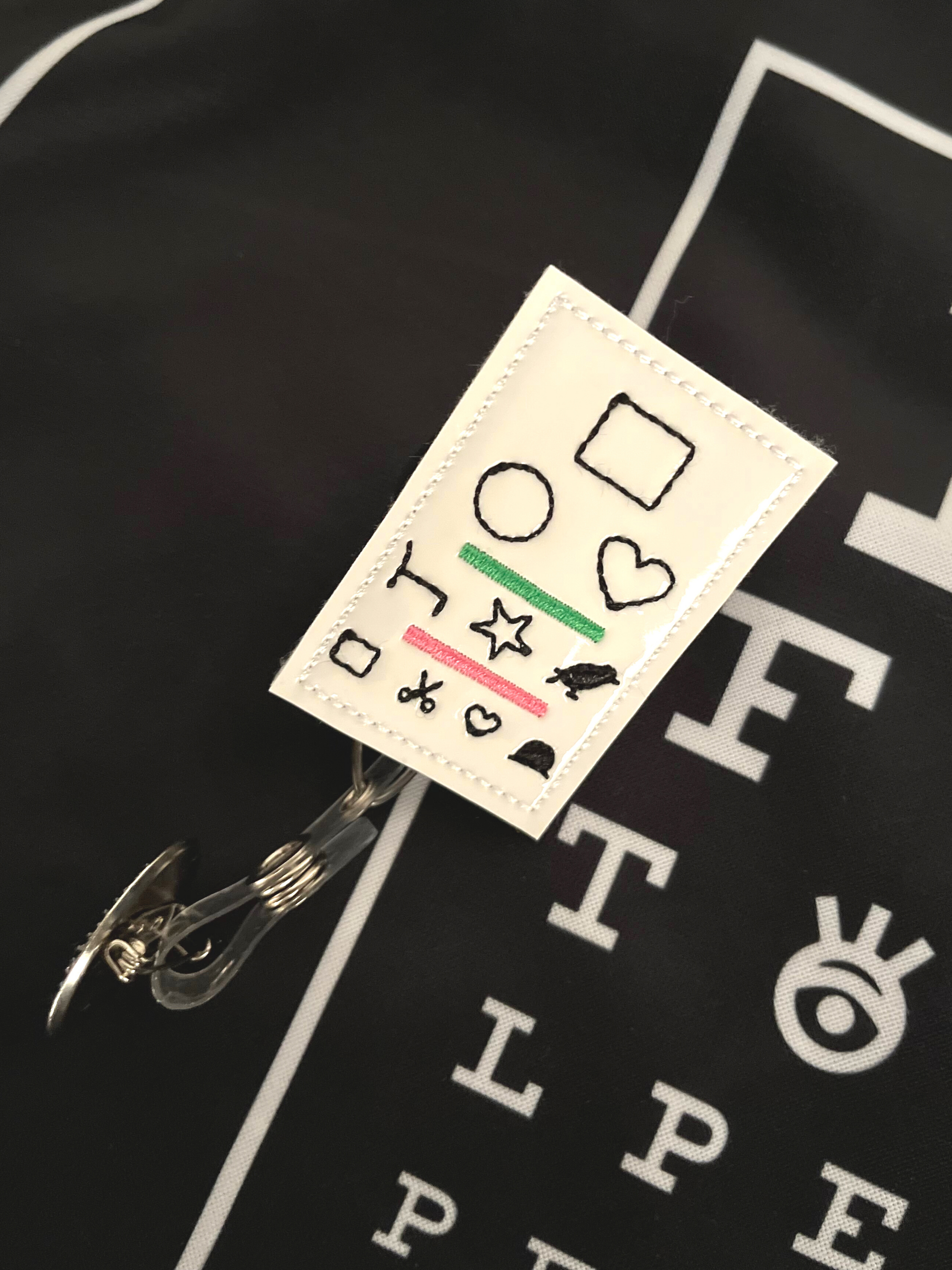 Badge Reel Accessory Eye Chart on Black 20/20 Vision Scrub Top