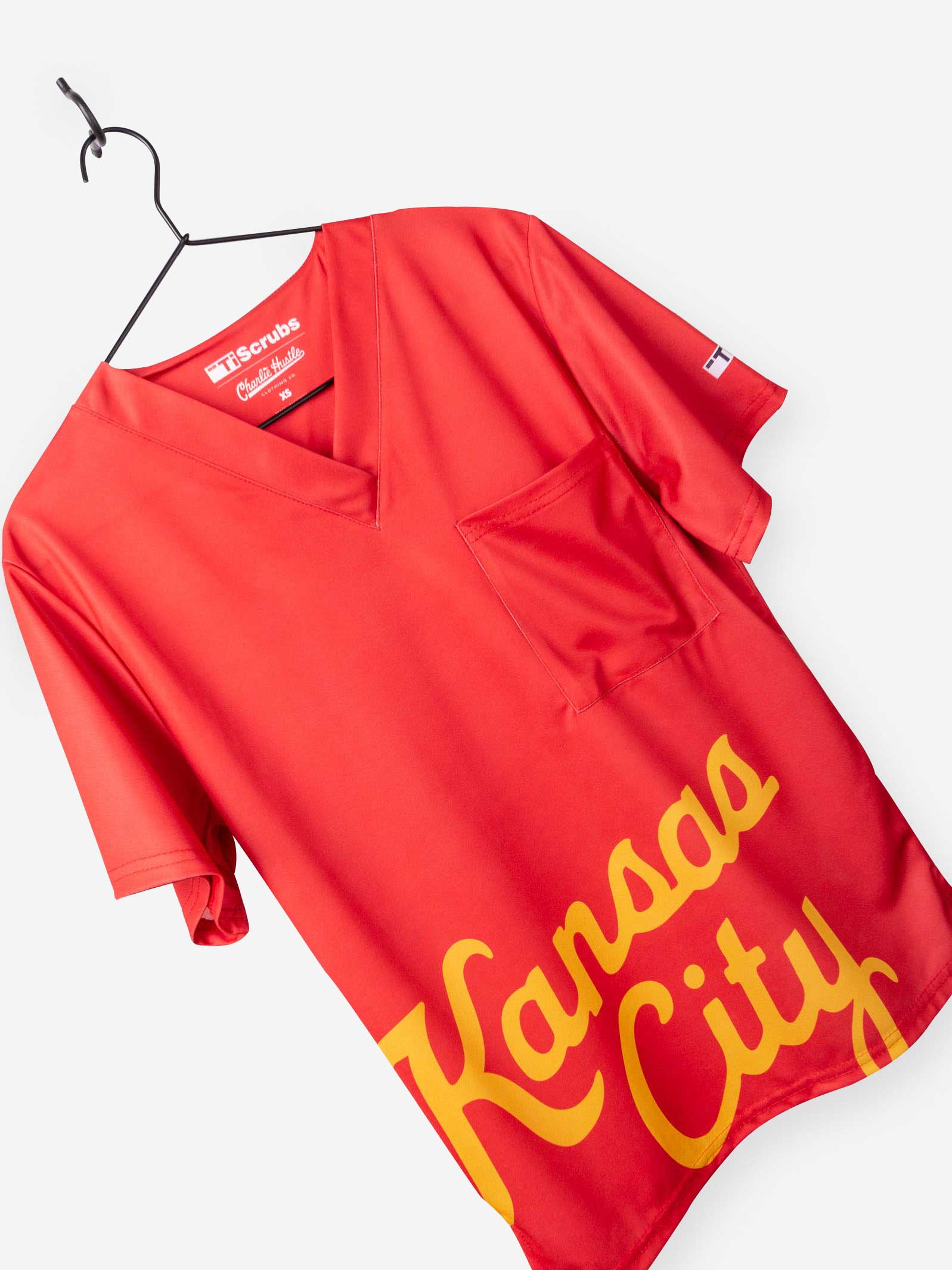 Men&#39;s Charlie Hustle Print Scrub Top with Kansas City Script in Red and Gold with Vneck