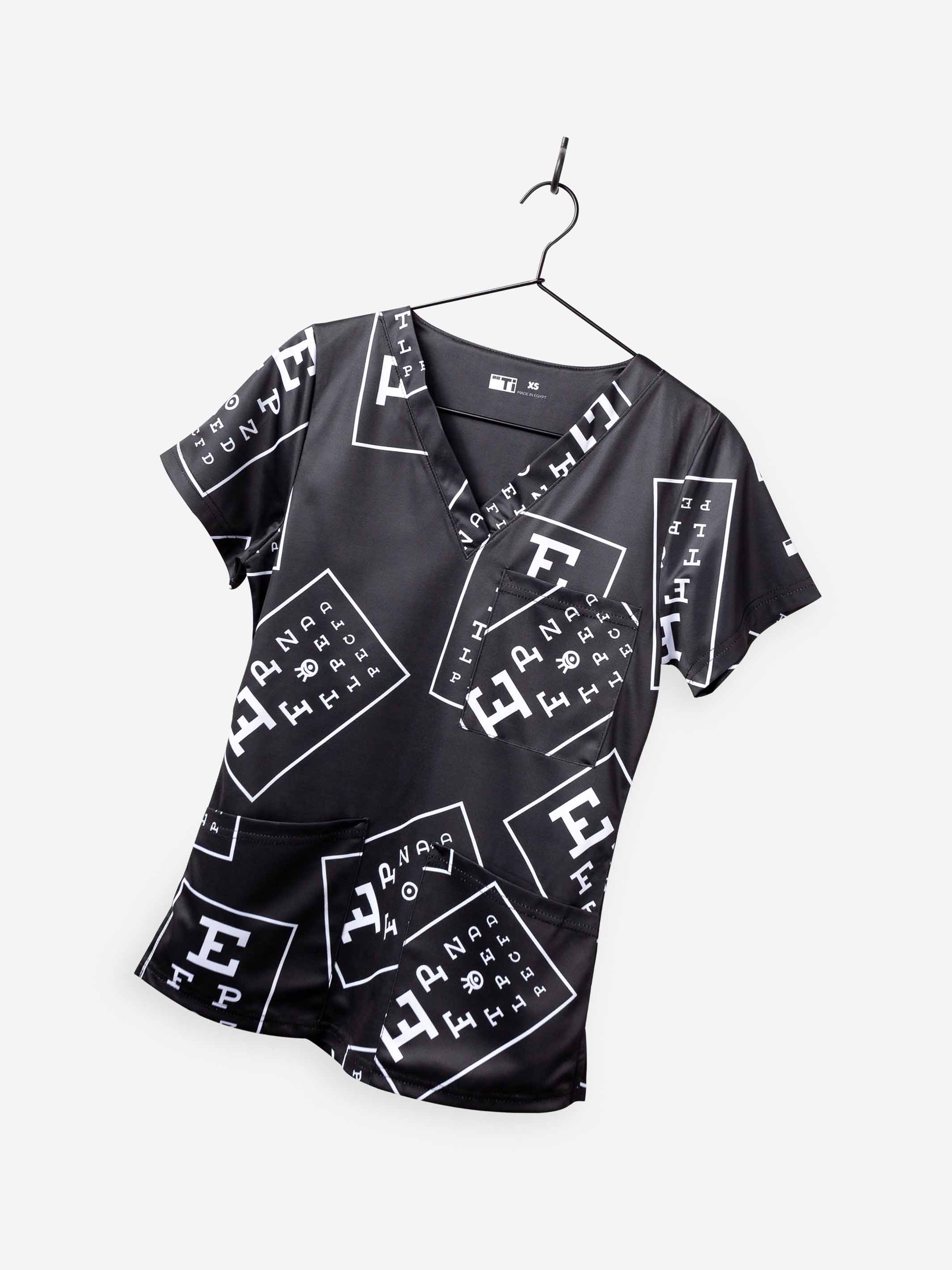 women's ophthalmology print scrub top black with white eye charts with 3 pockets