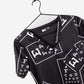 women's ophthalmology print scrub top black with white eye charts v-neck