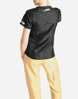 womens short sleeve black scrub top and khaki pants