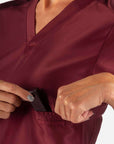 Women's Fitted Scrub Top in Bold Burgundy Pocket