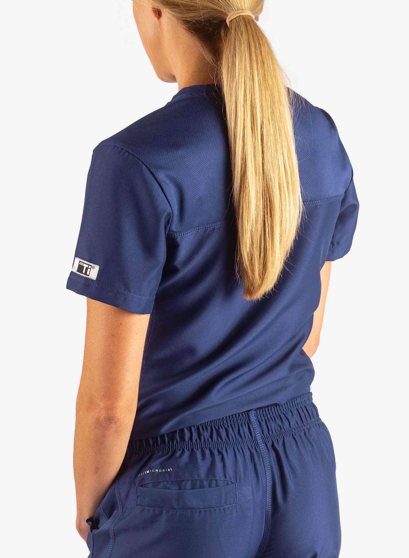 Women&#39;s Tuckable Scrub Top in navy-blue